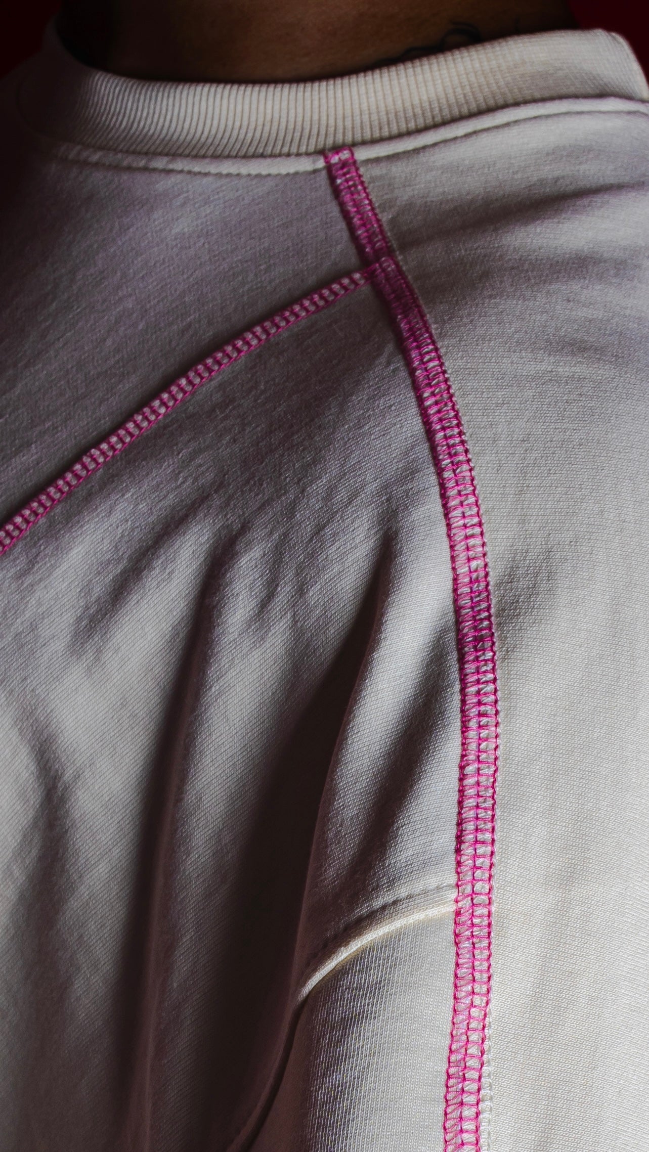 “BLOOD-STITCHED” RAGLAN SLEEVED — CREAM
