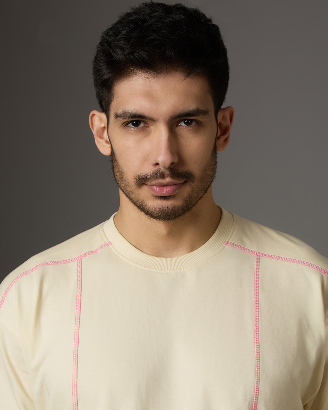 “BLOOD-STITCHED” RAGLAN SLEEVED — CREAM